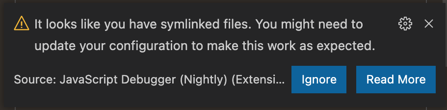 Notification that says "It looks like you have symlinked files. You might need to update your configuration to make this work as expected," with buttons to "Read More" and "Ignore"